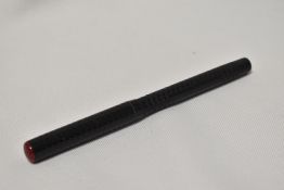A Redbreast eyedropper fountain pen in engine turned BHR with Red top to the cap having Redbreast,