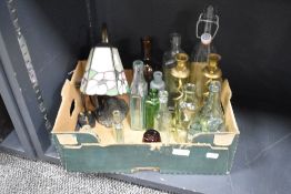 A small Tiffany style lamp, two brass twisted stem candlesticks and a selection of assorted