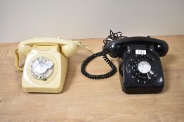 Two mid century rotary dial telephones.
