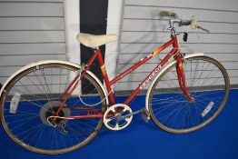 A vintage Peugeot Monte Carlo push bike.