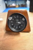 A mid century mahogany cased Smiths automobile clock.