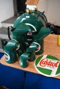 A selection of Catrol reproduction jerry cans, jugs and a plaque.