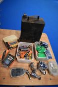 An assortment of vintage spark plugs, many in boxes, a bicycle lamp dynamo set and mirror, a jerry