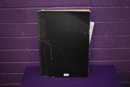 A vintage sketch pad, containing various amateur sketches including colouring pencils,