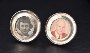A pair of George V silver-mounted photograph frames, of circular form, marks for London 1915,