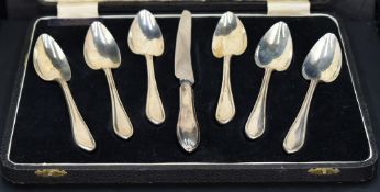 A cased set of six Queen Elizabeth II silver Sandringham pattern grapefruit spoons and curved