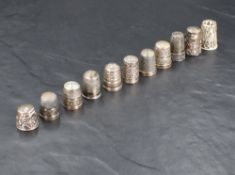 A selection of silver and white metal thimbles, of varying size, maker and design, gross weight