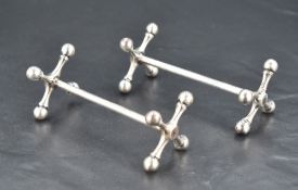 A pair Edwardian silver knife rests, of traditional design, marks for Birmingham 1903, maker