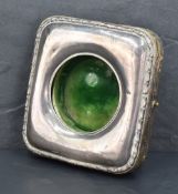 An Edwardian silver mounted picket watch holder, of hinged square form with rounded corners