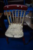 A vintage painted kitchen chair
