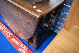 An early 20th Century oak twist gateleg dining table having oval top
