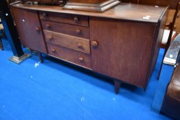 A vintage dark stained sideboard of stylised design, label for A Younger Ltd, width approx. 168cm