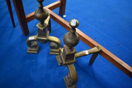 A pair of 19th Century heavy brass fire dogs