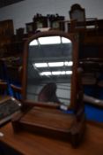 A Victorian mahogany toilet mirror having drawer base
