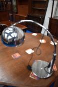 A modern chrome desk lamp