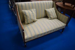 An Edwardian mahogany and satinwood settee, width approx. 130cm