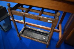An early 2th Century oak umbrella/stick stand with metal drip tray