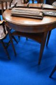 An early 20th Century mahogany occasional table having circular top and shaped undertier, diameter