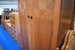 An impressive Art Deco golden oak bedrom suite comprising wardobe , narrow robe, high chest, low