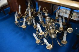 A pair of modern brass electrolier ceiling light fittings