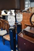 A pair of modern decorative standard lamps