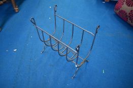 A modern wrought iron log holder