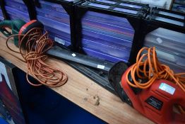 Two electric hedge trimmers