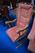 A traditional stained frame rocking chair