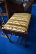 A late Victorian mahogany piano stool having drawer storage for sheet music , and later