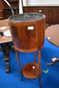 An Edwardian mahogany jardiniere stand