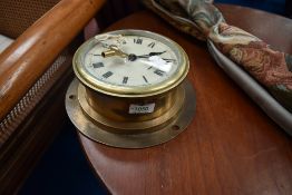 A vintage brass ship style 'porthole' clock