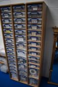 A laminate storage unit containing 42 'Really Useful' plastic storage containers, all containing