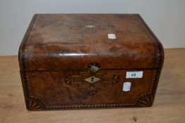 A Victorian inlaid walnut writing slope, having Mother of pearl escutcheon and geometric inlay.