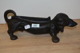 A cast iron daschund dog boot scraper