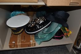 An assorted collection of headware, including a Royal Navy Admiral cap and ladies sun hats
