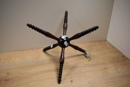 A late 18th/19th century 'cat' mahogany plate stand with central spherical boss.