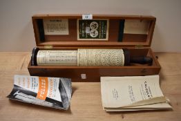 A vintage Fullers calculator in case.