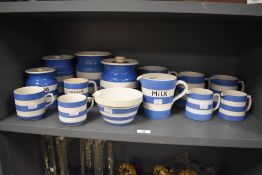 An assorted collection of T.G Green Cornish Ware lidded jars and tableware, some named and