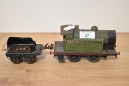 A clockwork O gauge GNR tank engine and LNWR truck.