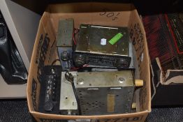 A box of vintage car radios