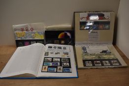 A collection of Royal Mail Millennium stamps, plus presentation packs with first day issues