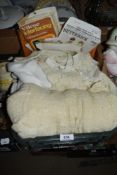 A mixed lot of vintage items, to include baby clothes, dress making patterns, Lace collar etc.