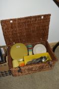 A vintage wicker picnic basket including Melaware plates, assorted cutlery etc