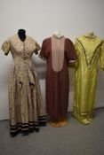 A suitcase containing an assortment of Victorian to early 20th century costume, some AF.