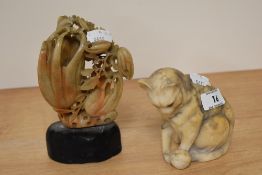 A Chinese soapstone carving of a floral arrangement, 16cm tall, together with a marble cat