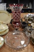A Bohemian cut glass footed vase, measuring 41cm tall, sold with a clear cut glass bowl.