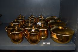 A selection of Royal Worcester porcelain lidded cups and lidded bowls, having full gilt decoration.