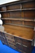 A dark stained Ercol dresser