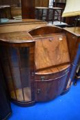 An early 20th Century walnut side by side bureau display