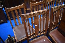 Two sets of four early to mid 20th Century oak dining chairs